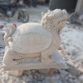 晚霞紅風(fēng)水龍龜石雕是怎么制作出來的？